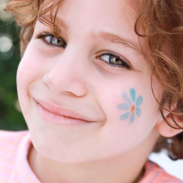 Kaveri Mehta, Lead Design Curator at CozyCampDeliver, reviewing corporate floral arrangements